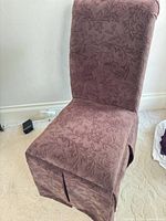Full view of mauve velvet Parsons side chair showing high back, skirted base and upholstery pattern