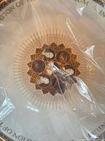 Close-up of central design under plastic wrap