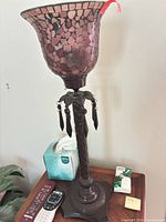 Full view of lamp showing mosaic glass shade, bronze column, prisms, base