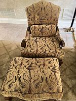 Front view of armchair and ottoman showing fabric pattern and overall design