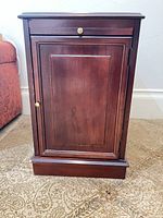 Front view of nightstand with closed door and drawer