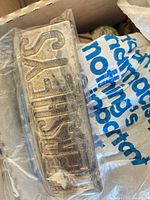 Rectangular metal Hershey’s mold in plastic wrap