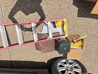 Werner step ladder, boxed vacuum, brown protective cover, wheel edge visible