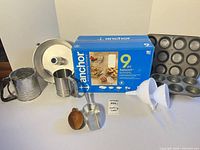 All items front view with box, pans, tools displayed