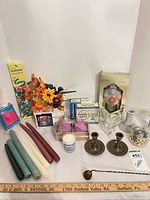 Full lot overview showing candles, candlesticks, vase, snuffer and florals