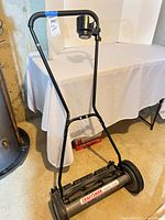 Full view of Craftsman 18" reel mower showing deck, wheels and handle
