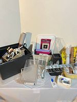 Overall view of assorted storage items on table