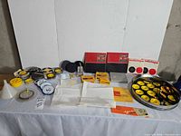 Overall view of assorted film reels, audio tape boxes, documentation