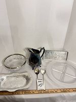 Group shot of all seven serving pieces with ruler for scale