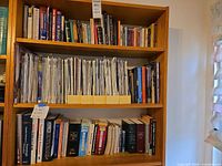 Full bookcase showing magazines and books