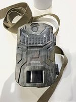 Front of iZEEKER camouflage trail camera with strap attached