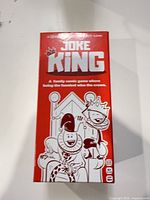 Front of red Joke King game box