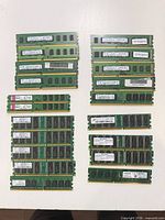 All 28 RAM modules laid out showing front labels and chips