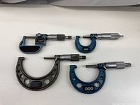 All three micrometers laid out showing overall condition and sizes