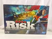 Front of Risk box showing modern artwork and title