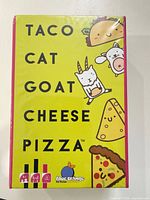 Front of sealed Taco Cat Goat Cheese Pizza card game box