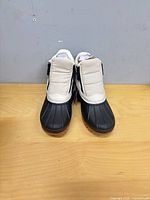Front view of both boots showing uppers and soles