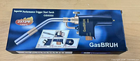 Front of sealed box showing full image of GB8000 torch and branding