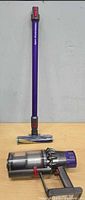 Main vacuum body and wand with floor head on table