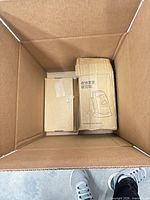 Overall view of open shipping box with two plain boxes visible