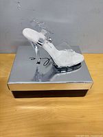 side view of right sandal on box