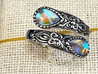 Close-up of ring showing cabochon stones, filigree detail, 925 stamp area not visible