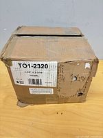 Closed box showing product label TO1-2320 dimensions