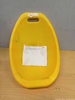 Front view of yellow scoop rocker chair