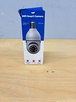 Front of boxed WiFi smart camera