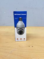 Front of retail box showing WiFi Smart Camera image and features icons