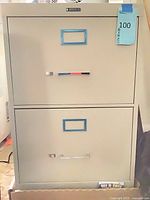 Front view of beige 2-drawer metal lateral filing cabinet