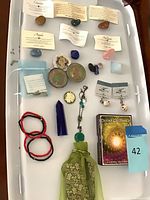 Full tray view showing all crystals, jewellery pieces, pouch and oracle deck