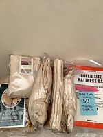 All packaged items: tablecloth, napkin packs, mattress bag