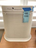 Front view of Honeywell air purifier with grille and brand name