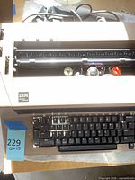Top view of IBM Correcting Selectric III showing keyboard, typeball, ruler bar, and IBM logo