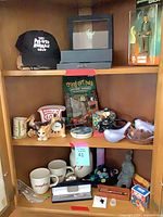 Full view of cabinet shelves with majority of items