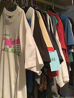 Rack of assorted T-shirts showing variety of colours and graphics