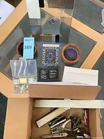 All items grouped in and around a cardboard box for overview