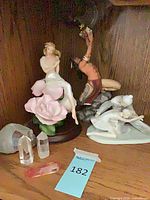 Group of figurines and crystals on shelf