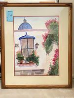 Framed watercolor painting showing window scene with floral vines