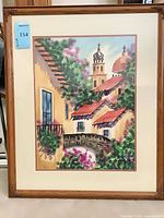 Full view of framed artwork showing image, matting, and wood frame