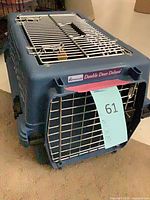 Front corner view showing brand label, front metal door and blue plastic body