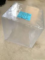 Angled front view of clear acrylic cube