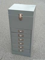 full view of gray metal storage cabinet front closed