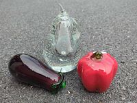 Group shot of pear, pepper and eggplant paperweights