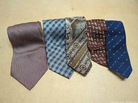 Front view of five assorted silk neckties