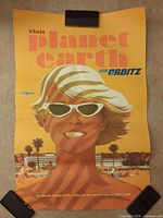 Full view of rolled Orbitz Visit Planet Earth poster clipped at top and bottom