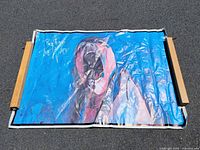 Full view of rolled-out poster showing size, artwork and condition