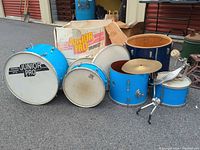 Full set of blue sparkle drums, cymbal, hardware and original box
