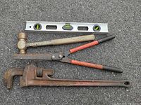 group shot of all four tools on asphalt